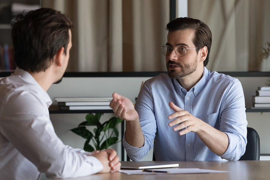 Manager Discussing With Employee AllAboutLean